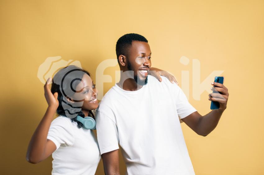 Girl and boy looking at a phone