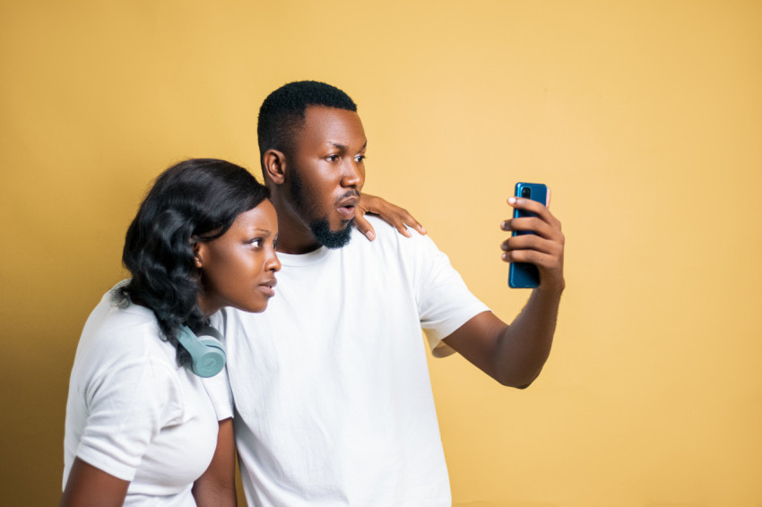 Girl and boy looking at a phone