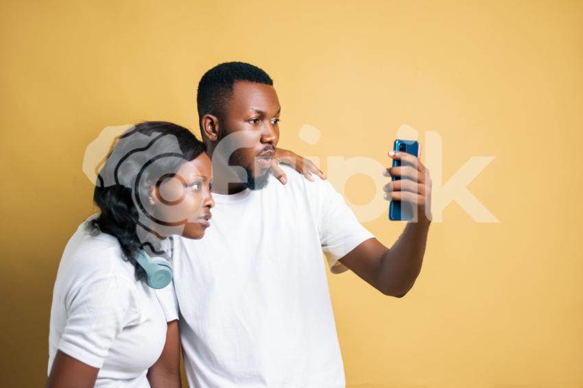 Girl and boy looking at a phone