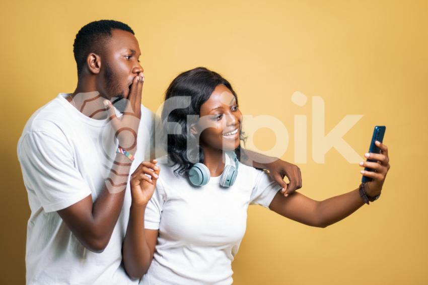 Boy  and girl looking at a phone