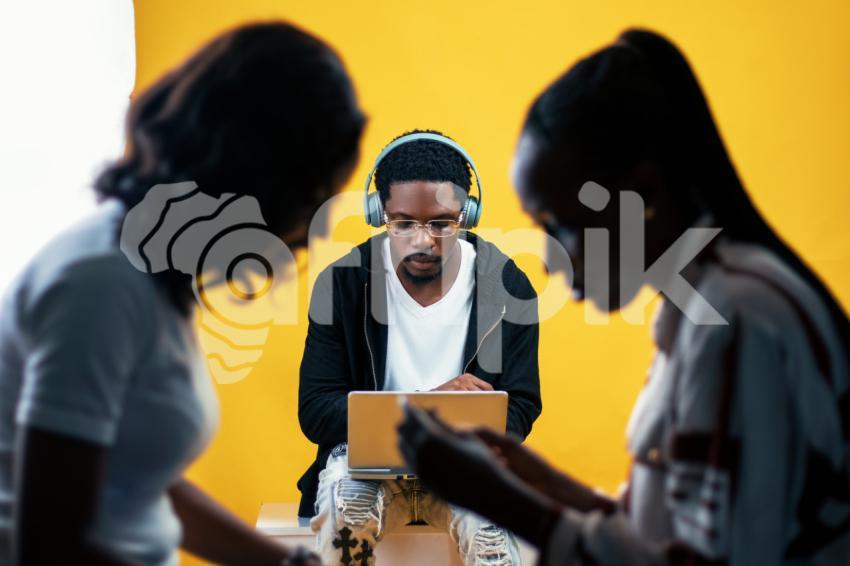 Boy pressing his laptop