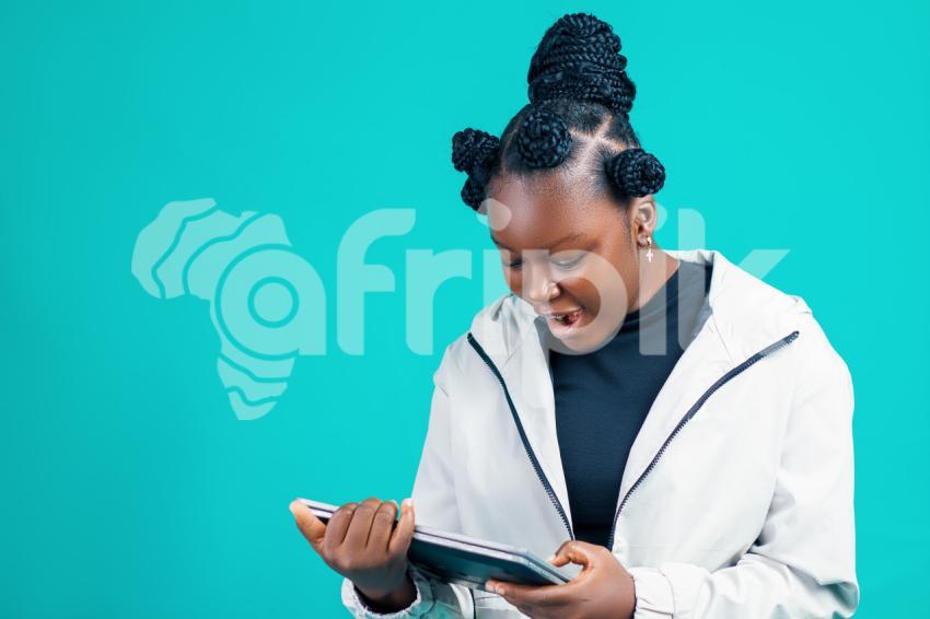 Girl looking at her laptop happily