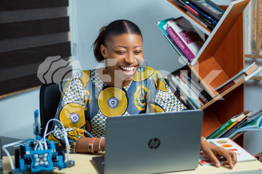 Girl on her laptop laughing