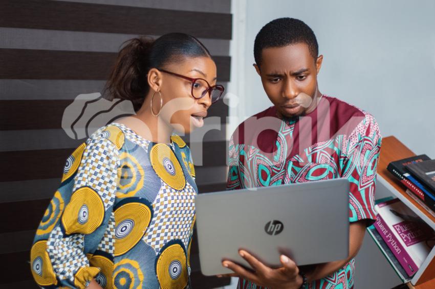 Colleagues on a laptop shocked