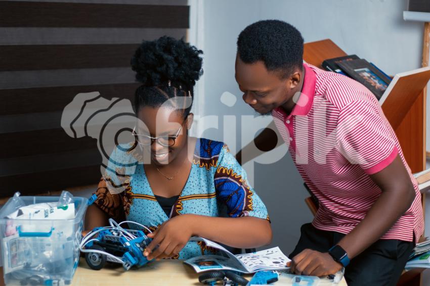 Stem educators using a robotics kit