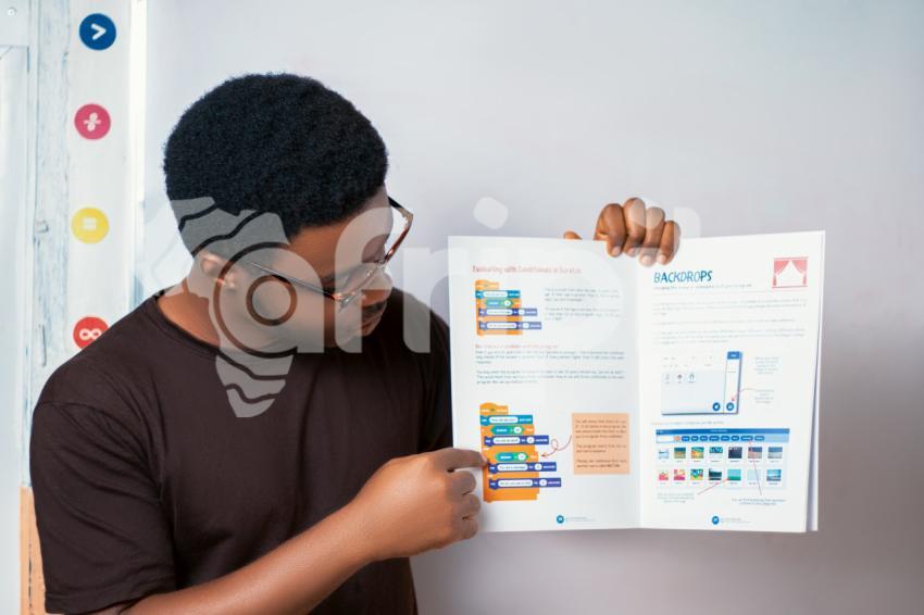 Teacher teaching with a book