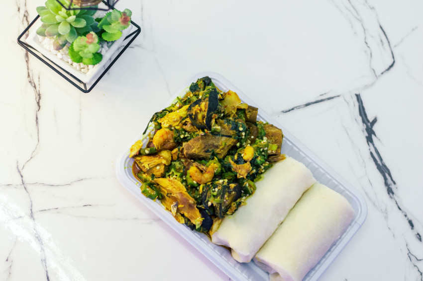 A plate of seafood okro with fufu