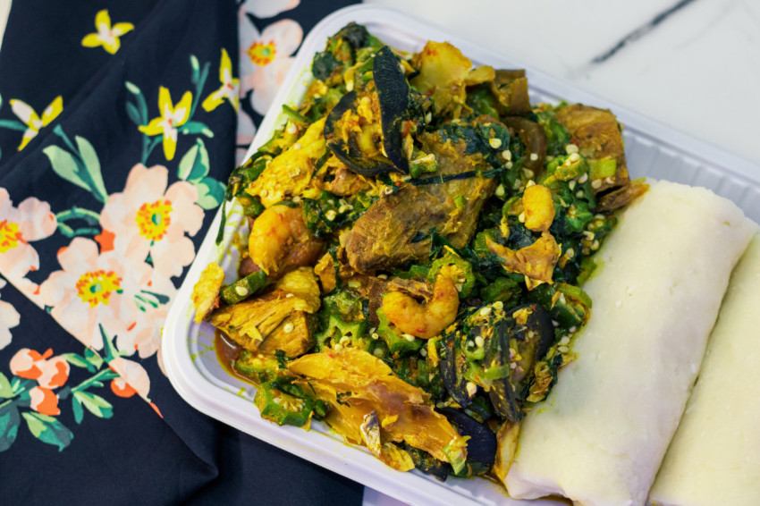 A plate of seafood okro with fufu 1