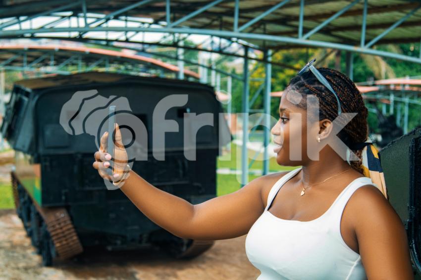 Girl taking a selfie with her phone