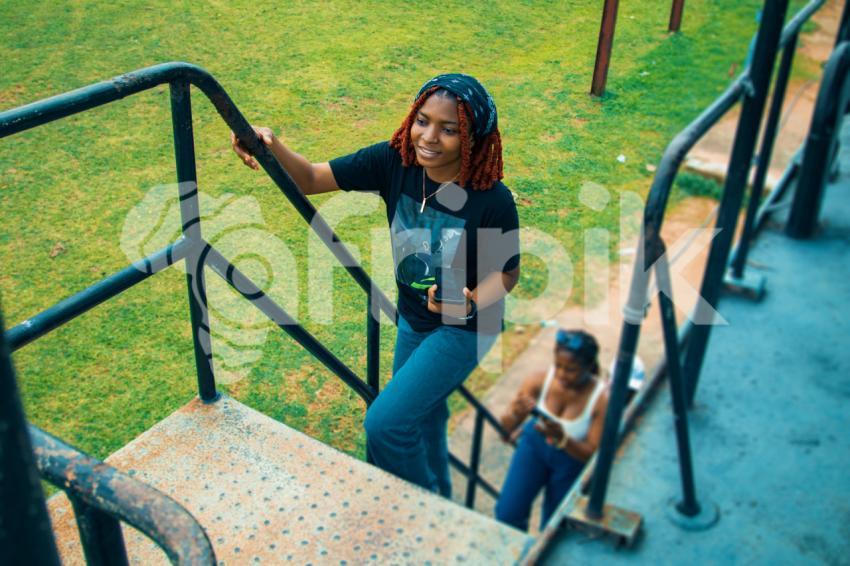 Two ladies climbing a war ship