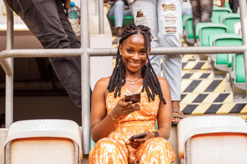 Girl sitting with phone