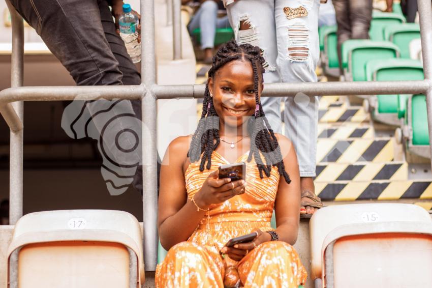 Girl sitting with phone