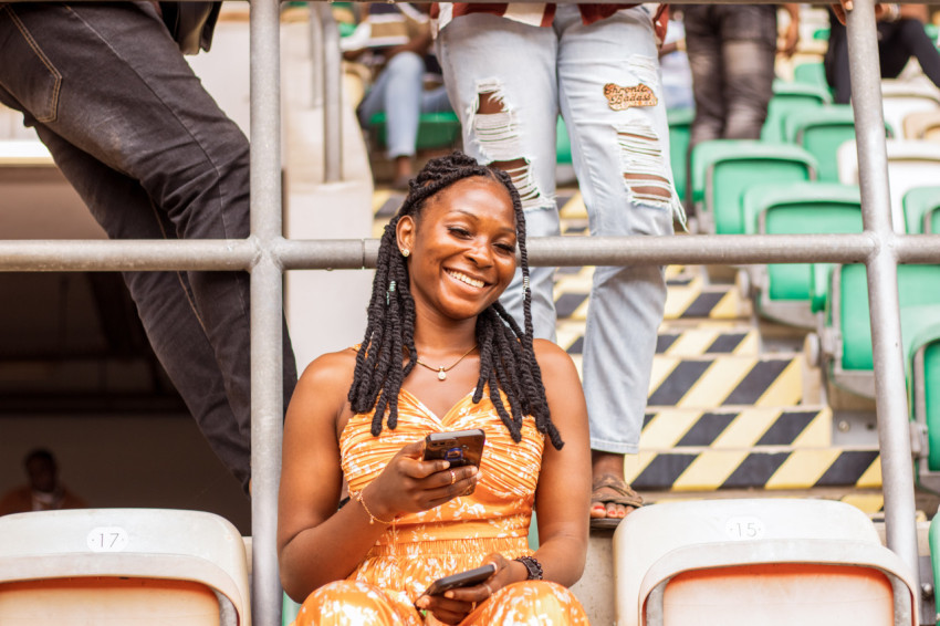 Girl sitting in stadium