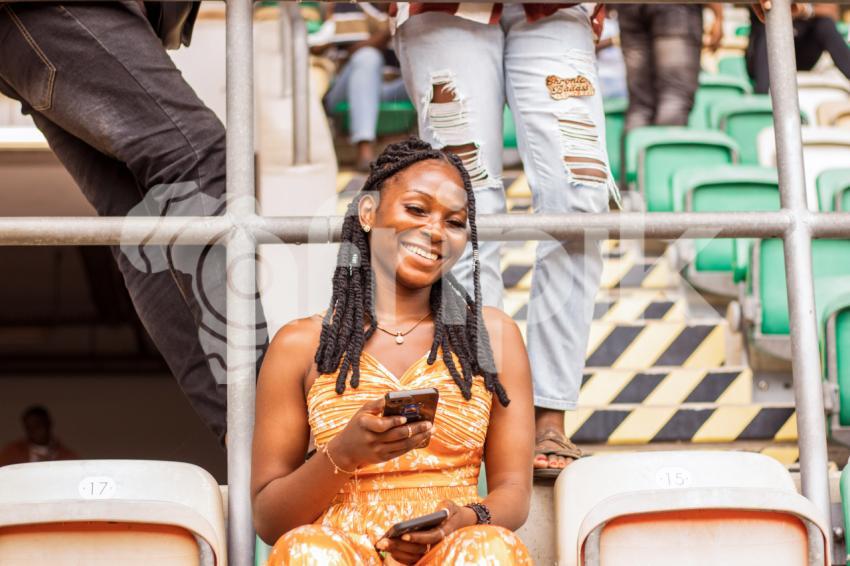 Girl sitting in stadium