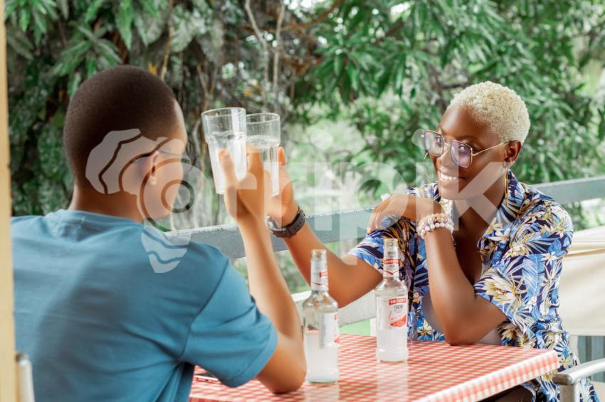 Boy and girl hanging out in Ibom Icon