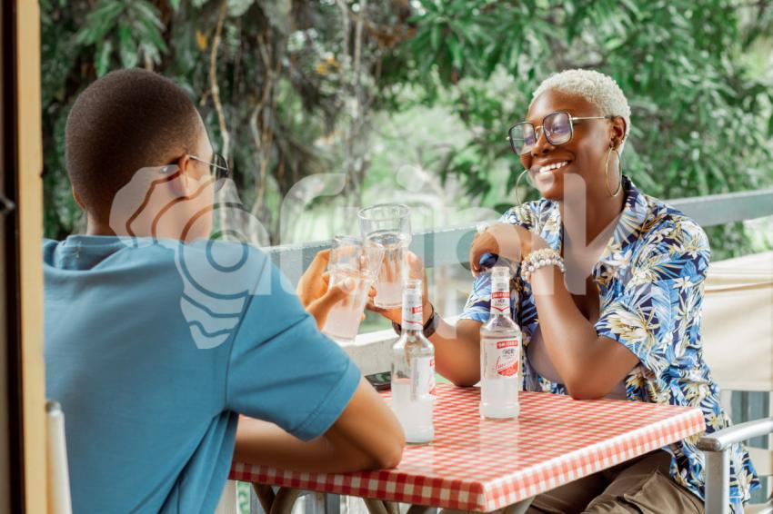 Boy and girl having a drink