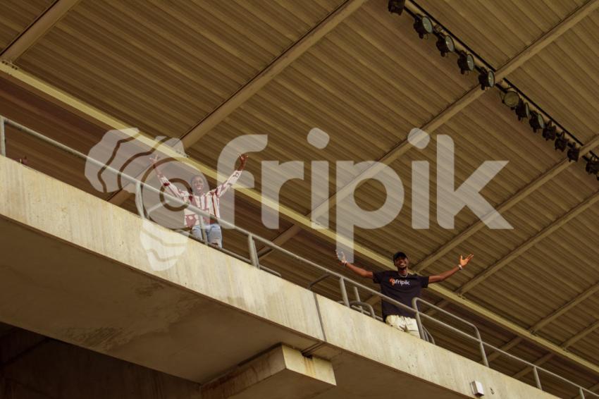boy and girl cheering from top