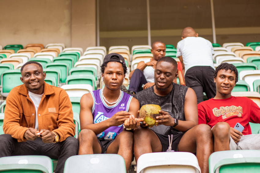 Boys sittingin stadium