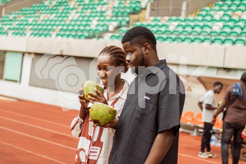 boy and girl with coconut drink 1