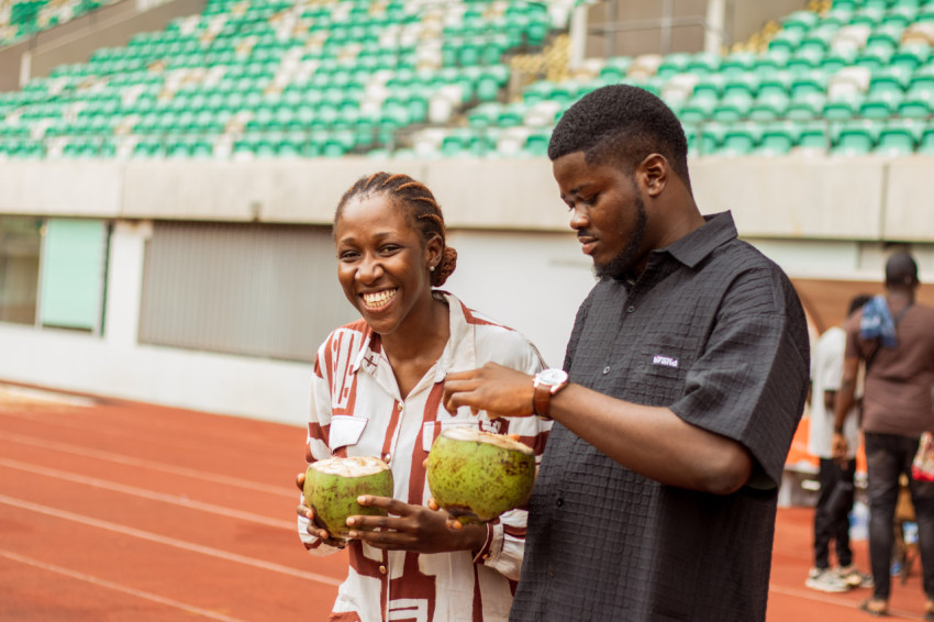 Girl and boy with coconut drink 2