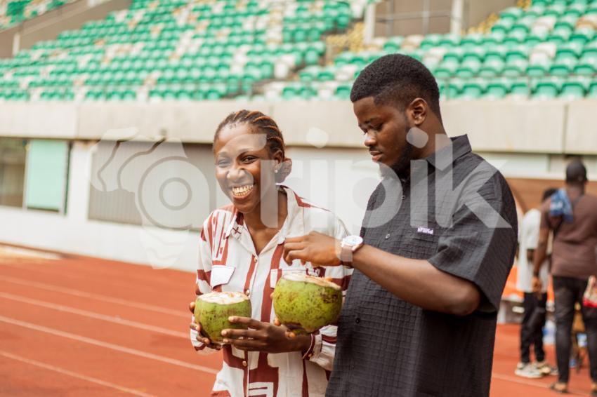 Girl and boy with coconut drink 2