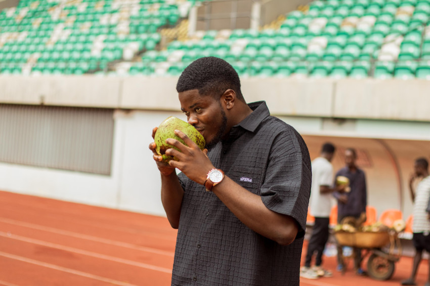 Boy taking coconut drink