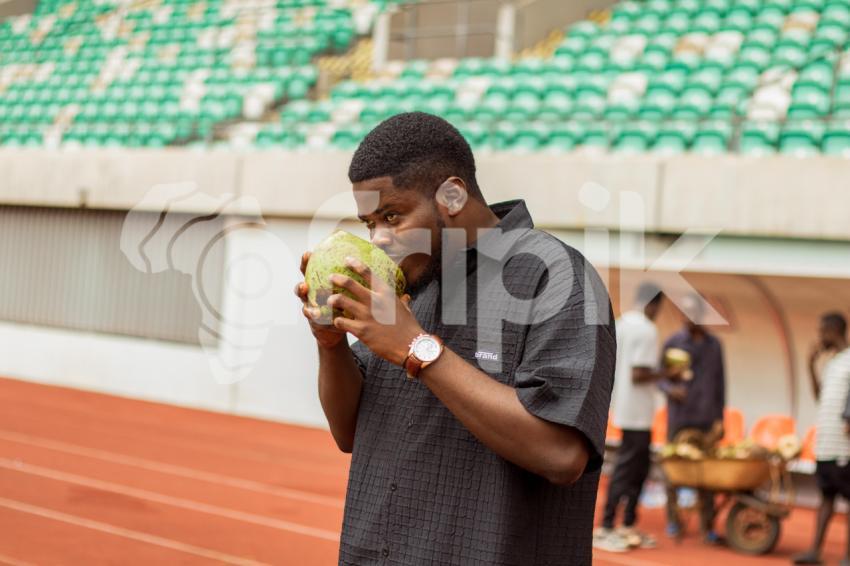 Boy taking coconut drink