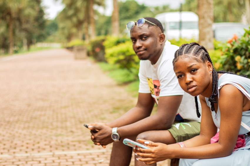 A boy and girl sitting