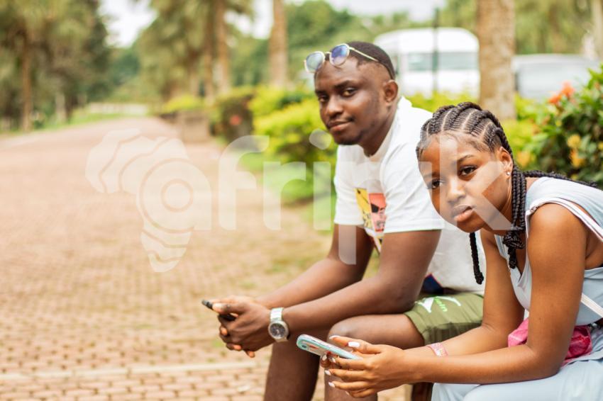 A boy and girl sitting