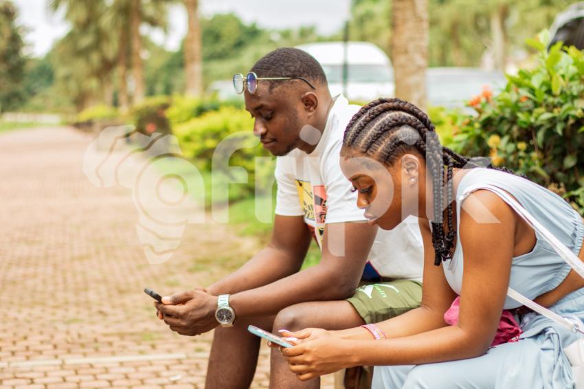 A boy and girl sitting 1
