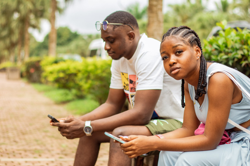 A boy and girl sitting 2