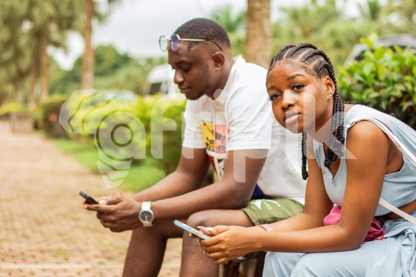 A boy and girl sitting 2