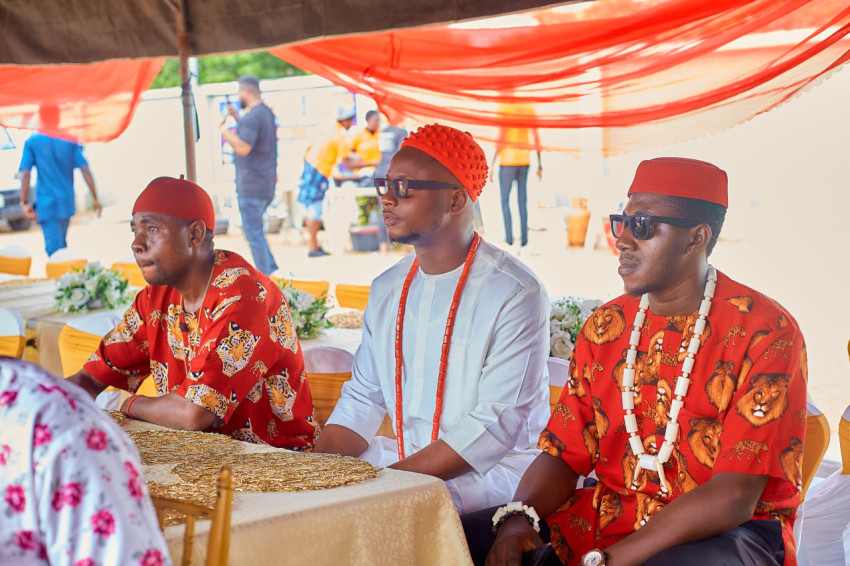 Men seated at a cultural event