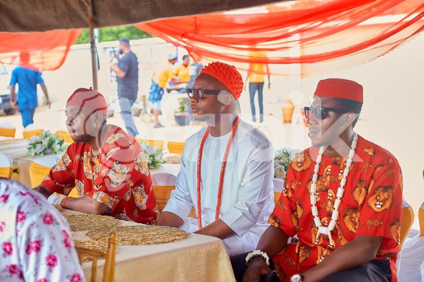 Men seated at a cultural event