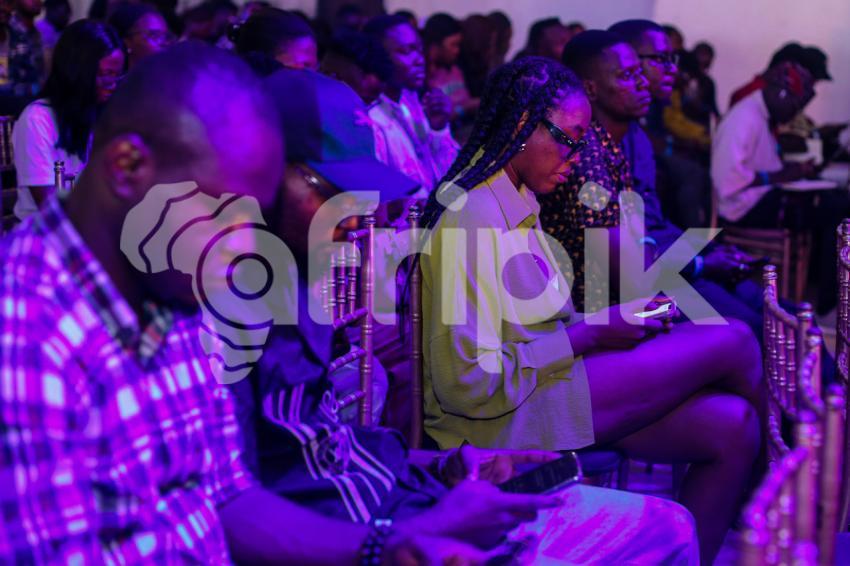 Attendees pressing their phones at UDC 2024