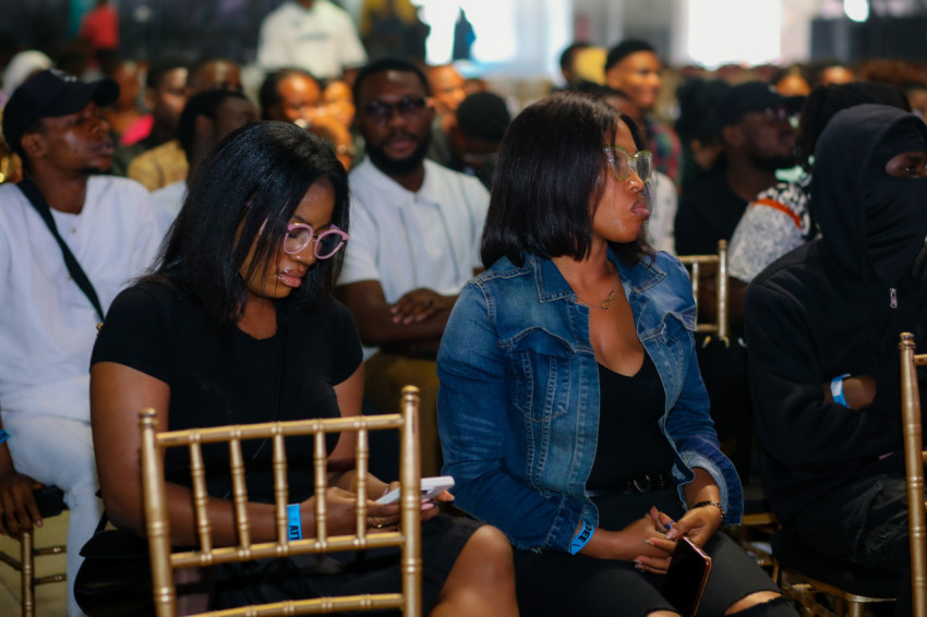 Female attendees listening at UDC 2024