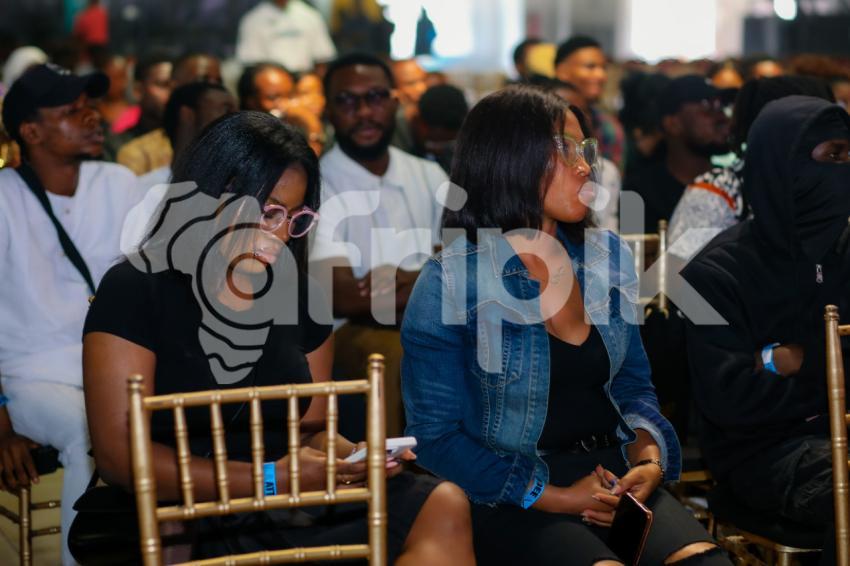 Female attendees listening at UDC 2024