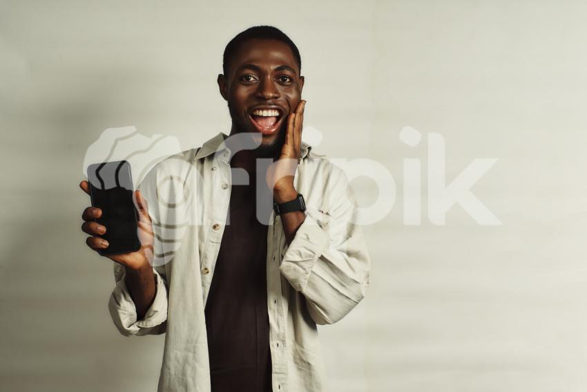Boy with phone smiling 1