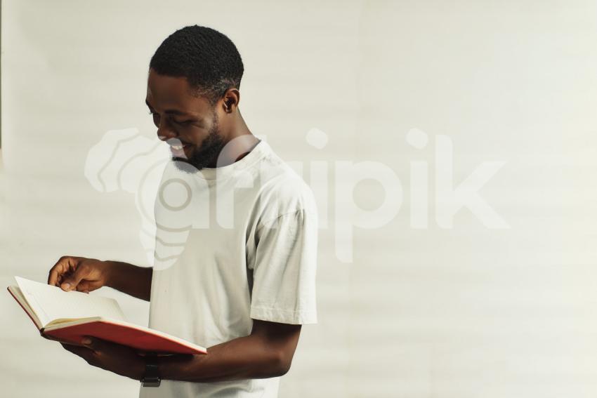 Happy boy reading a book