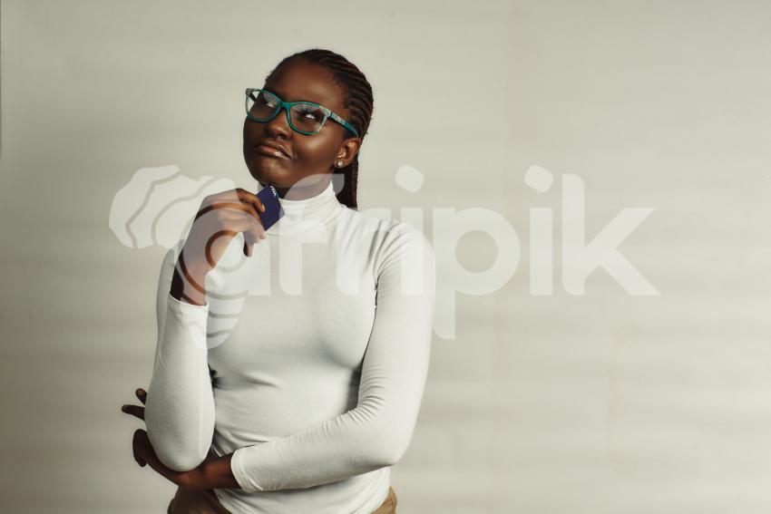 Girl with credit card thinking