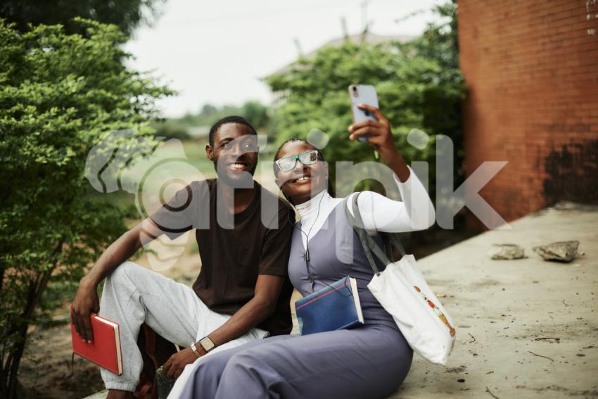 Boy and girl taking selfie
