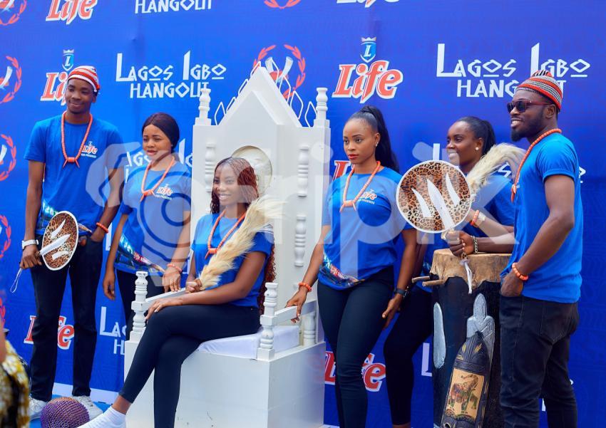 Group of people posing with a throne