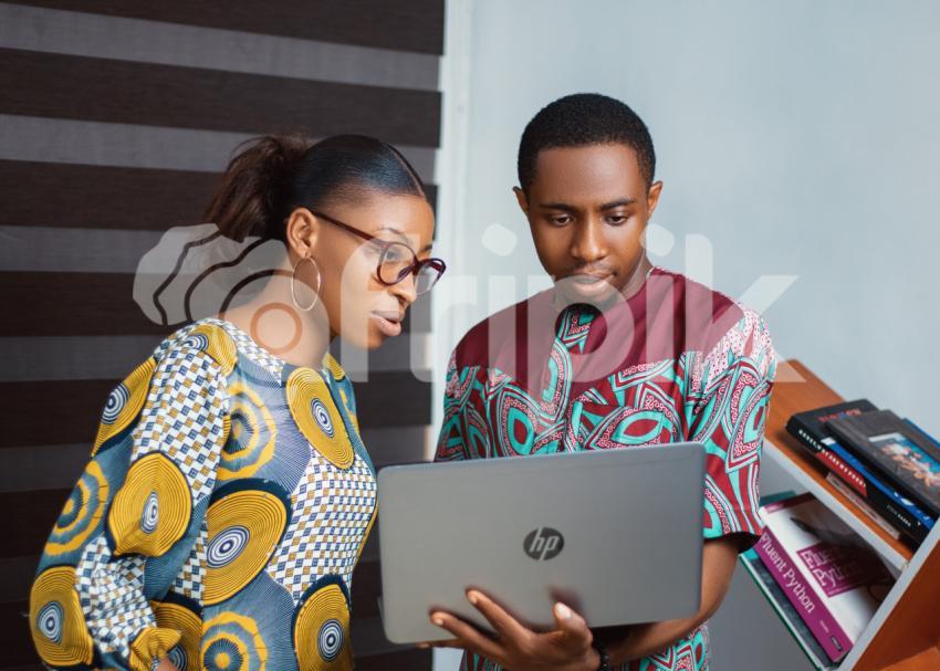 Colleagues working on a laptop