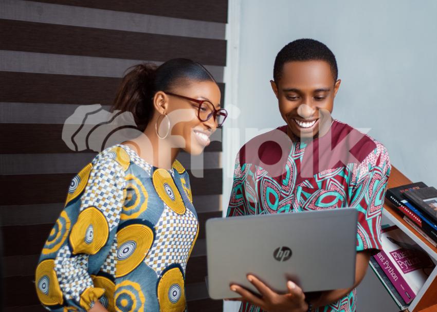 Colleagues working on a laptop