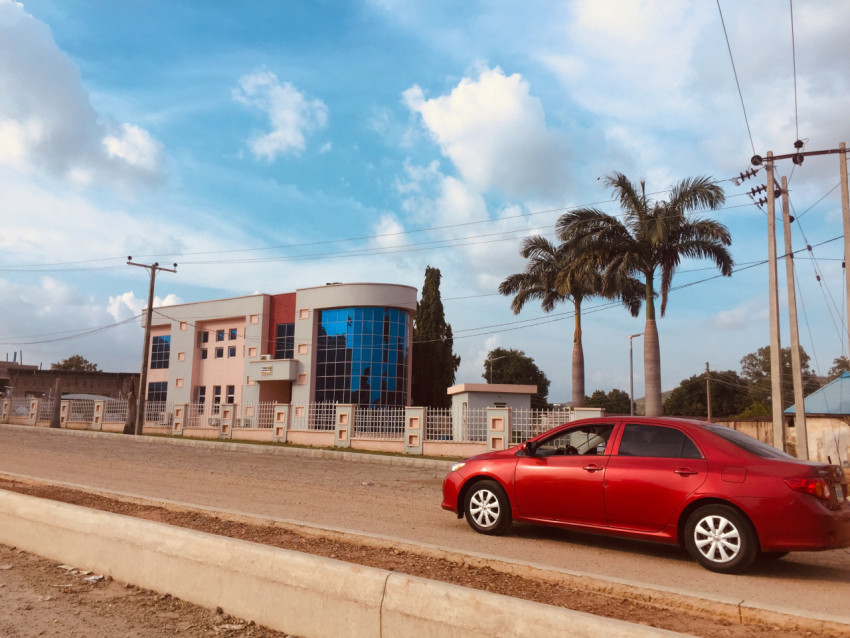 A car driving close to a building