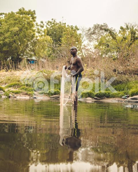 A fisherman with his fishing net