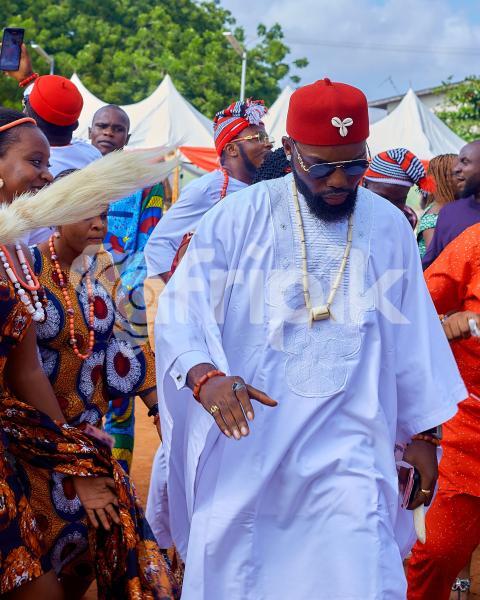 A boy wearing white traditional outfit