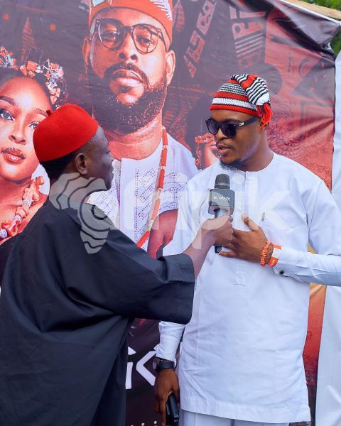 Boys in cultural attire talking