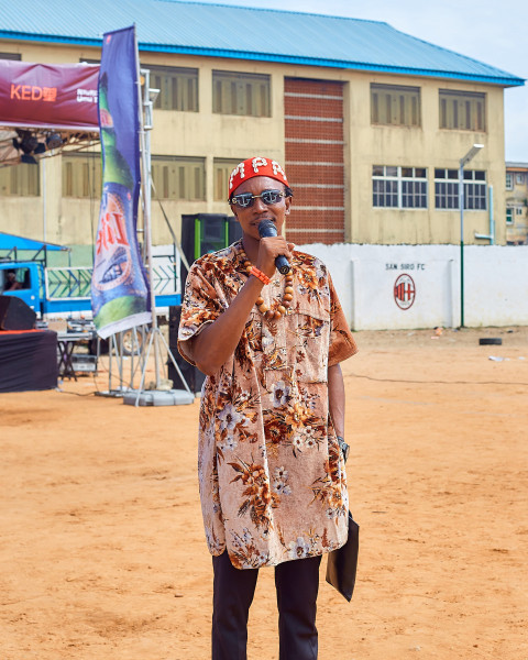 Boy wearing cultural attire talking