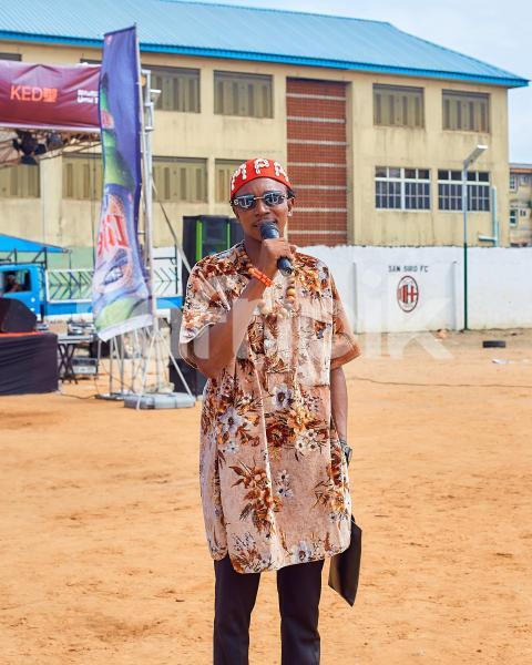 Boy wearing cultural attire talking